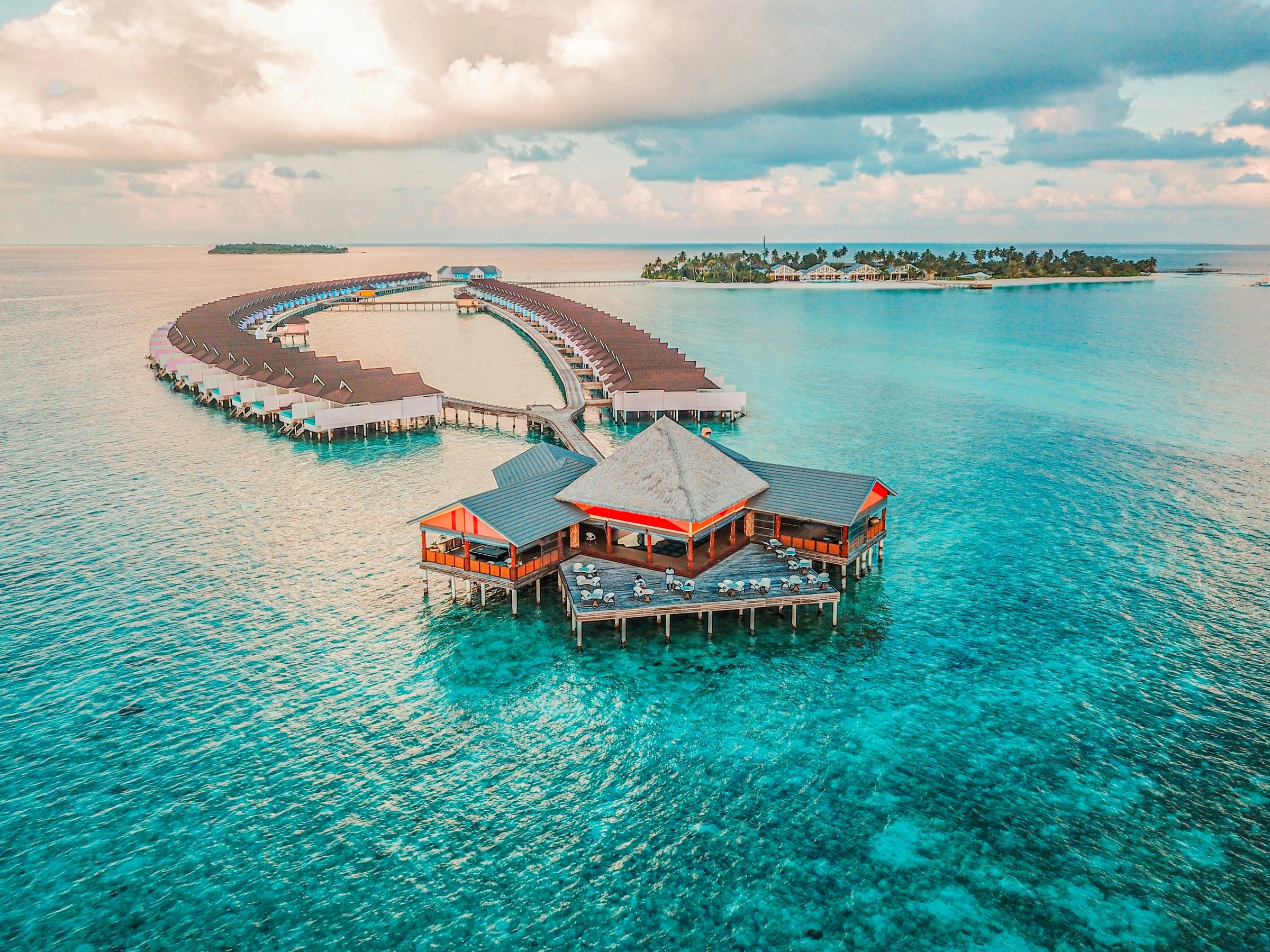 An island wellness retreat surrounded by turquoise water